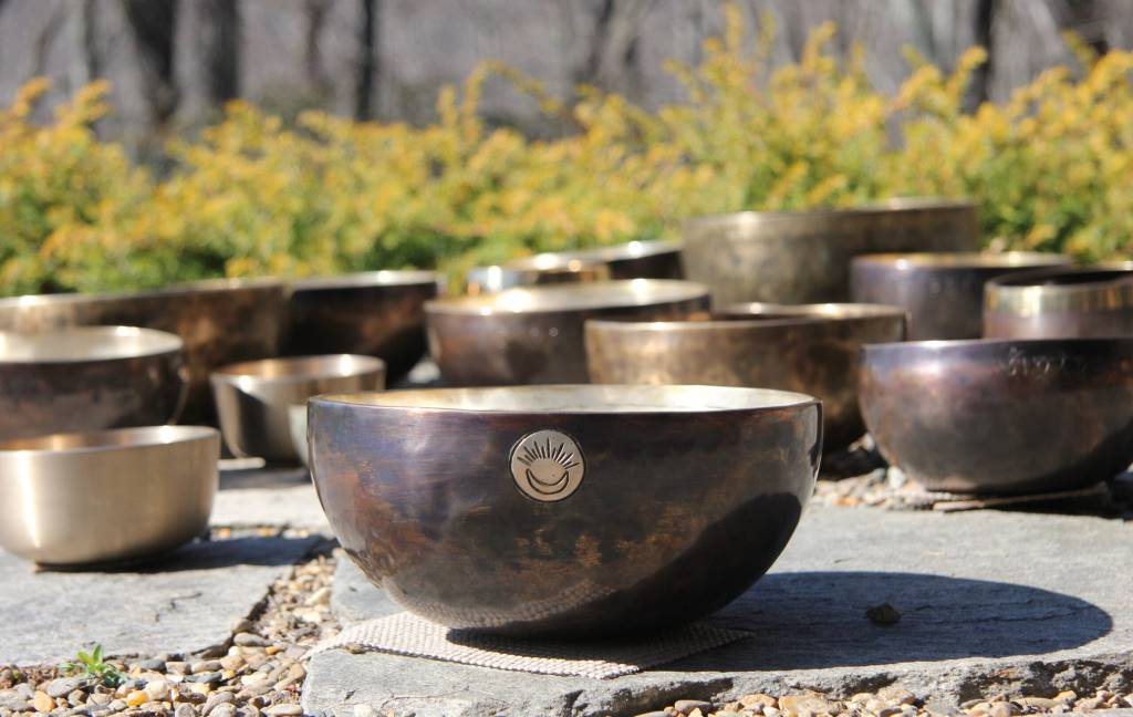 Himalayan singing bowls arranged for a sound healing session